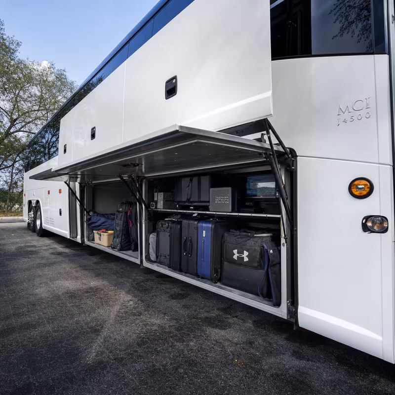 Party bus interior with wraparound leather seating and LED lighting in Pittsburgh