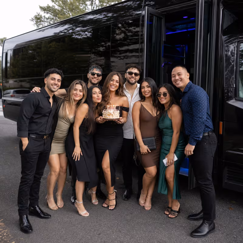 Group boarding a white charter bus for Birthday Transportation transportation in Pittsburgh