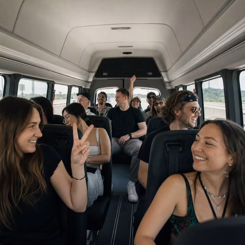 Party bus interior with wraparound leather seating and LED lighting in Pittsburgh