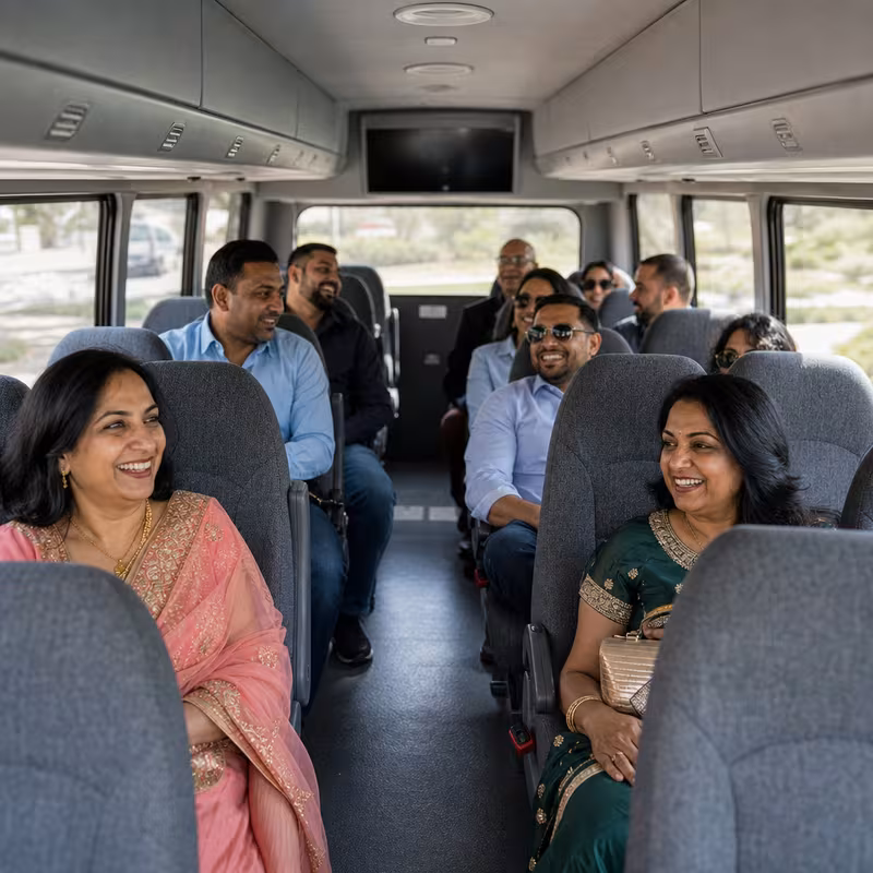 Group boarding a white charter bus for Private Event Transportation transportation in Pittsburgh