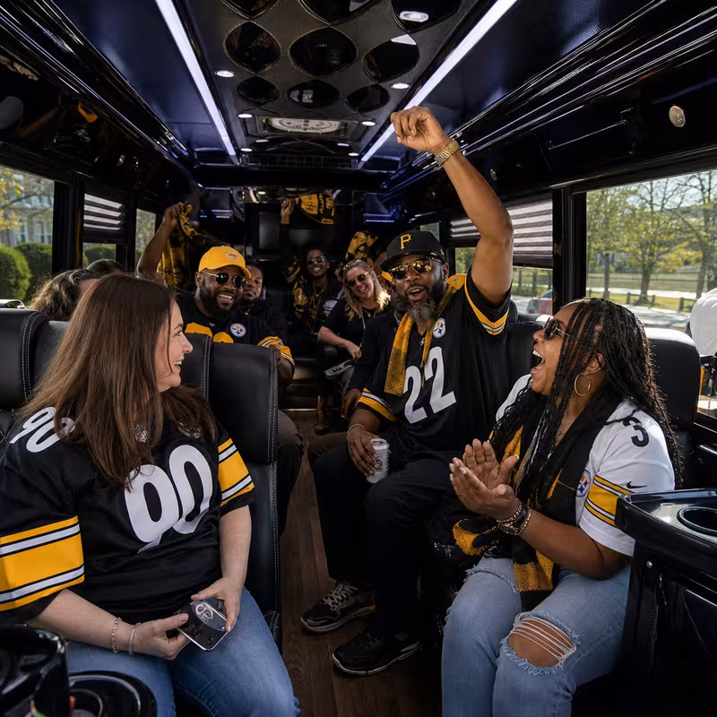 Group boarding a white charter bus for Sporting Event Transportation transportation in Pittsburgh