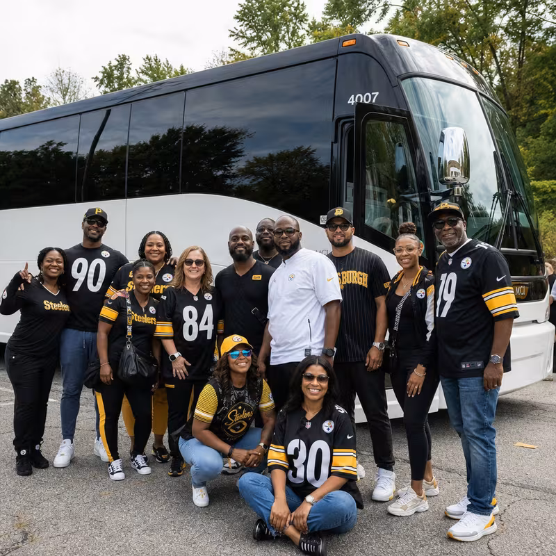 Passengers loading luggage while boarding an Pittsburgh group shuttle