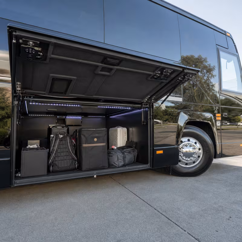 Party bus interior with wraparound leather seating and LED lighting in Pittsburgh