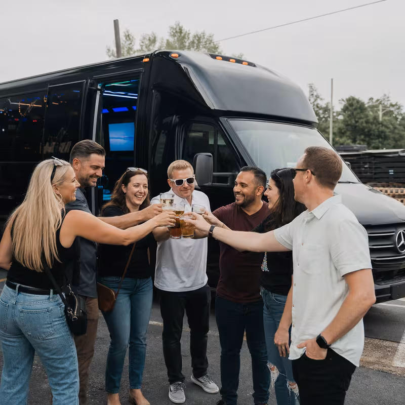 Passengers loading luggage while boarding an Pittsburgh group shuttle